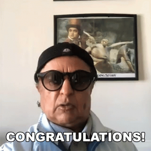 Man in Sunglasses and Hat Says Congratulations