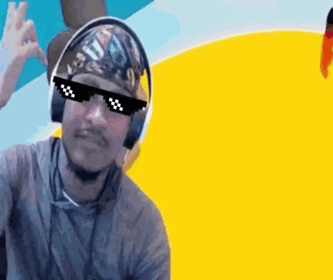 Man in Sunglasses and Headphones Giving OK Sign
