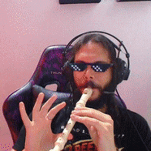 Man in Sunglasses and Headphones Playing Flute