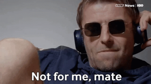 Man in Sunglasses and Headphones Saying Not For Me Mate