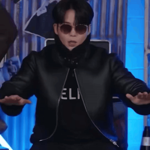 Man in Sunglasses and Jacket Saying Eli