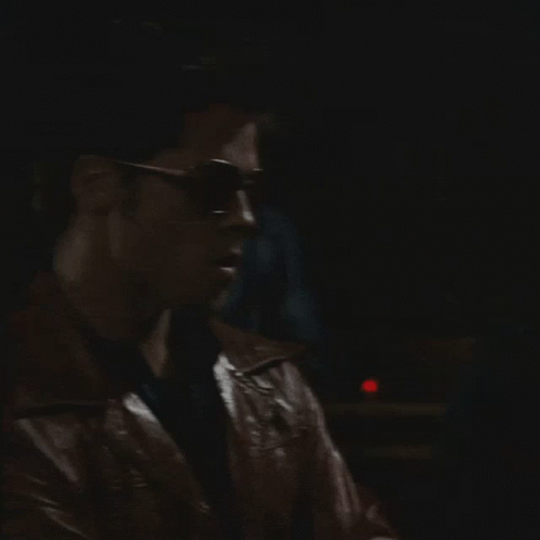 Man in Sunglasses and Leather Jacket Looking Left