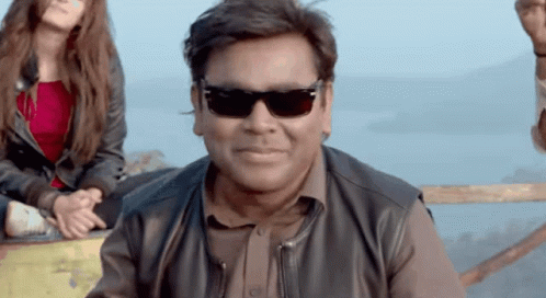 Man in Sunglasses and Leather Jacket Smiling