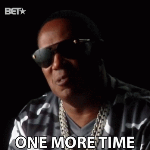 Man in Sunglasses and Necklace Saying One More Time