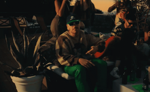 Man in Sunglasses and Omega Hat