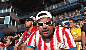 Man in Sunglasses and Paraguay Jersey in Crowd
