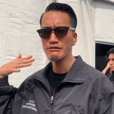 Man in Sunglasses and PCJ Jacket Making Funny Face
