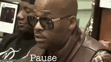Man in Sunglasses and Plaid Shirt Says Pause