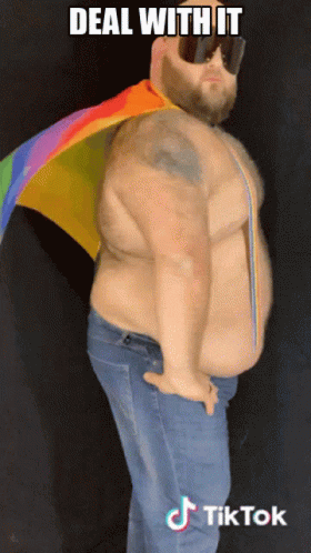 Man in Sunglasses and Rainbow Cape Saying Deal With It
