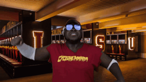 Man in Sunglasses and Red Cyclonemania Shirt