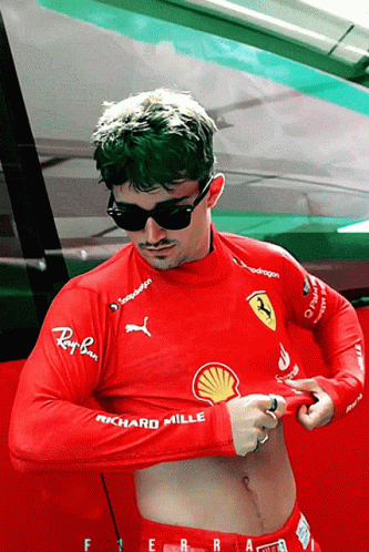 Man in Sunglasses and Red Shirt Richard Mille