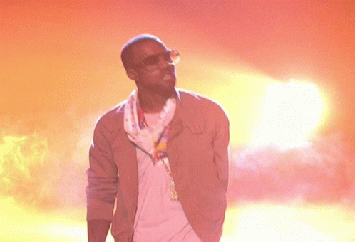 Man In Sunglasses And Scarf At Sunset GIF