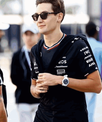 Man in Sunglasses and Shirt Saying IWC