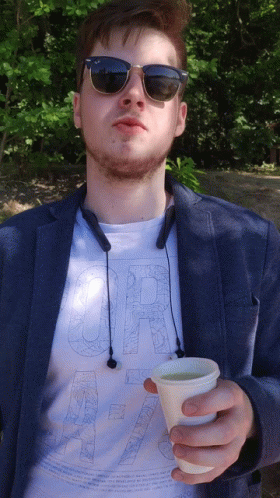 Man in Sunglasses and Shirt Saying or