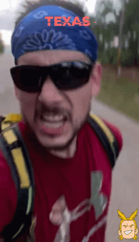 Man in Sunglasses and Texas Bandana