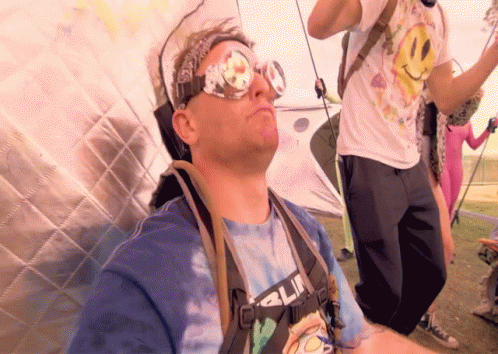Man in Sunglasses and Tie Dye Shirt