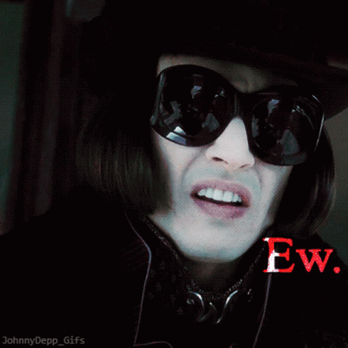 Man in Sunglasses and Top Hat Saying Ew