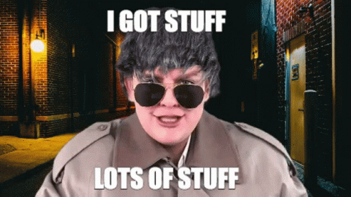 Man in Sunglasses and Trench Coat Saying I Got Stuff Lots of Stuff