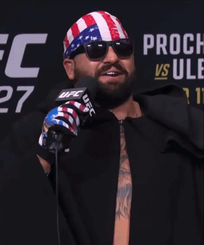 Man In Sunglasses And UFC Bandana In Front Of Microphone GIF