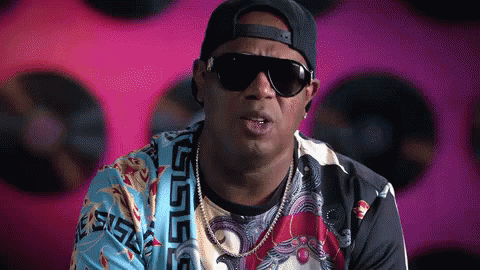 Man in Sunglasses and Versace Shirt