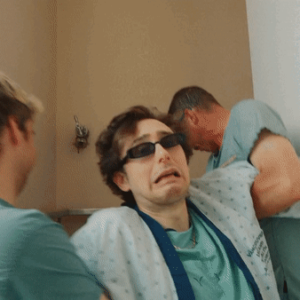 Man In Sunglasses And Virginia Memorial Hospital Gown GIF