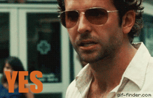 Man In Sunglasses And White Shirt Says Yes GIF