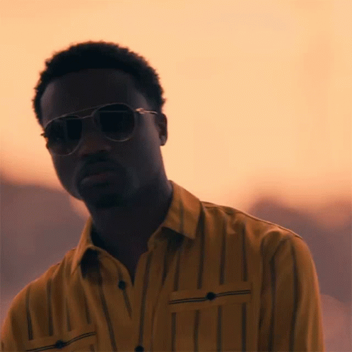 Man in Sunglasses and Yellow Shirt