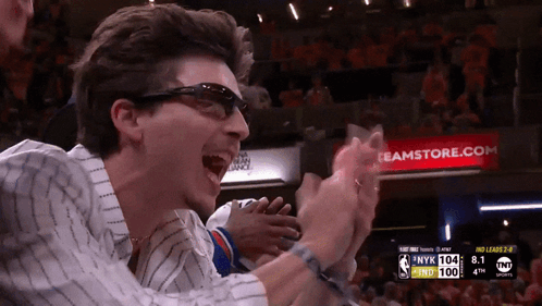 Man in Sunglasses Applauding at Basketball Game Banner Bamstore.com