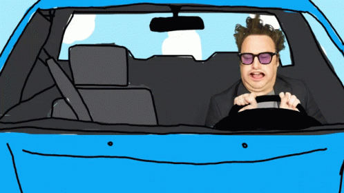 Man in Sunglasses Driving Car