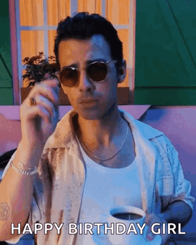 Man in Sunglasses Holding Coffee and Smoking Cigarette