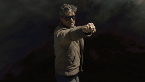 Man In Sunglasses Holding Green Object GIF