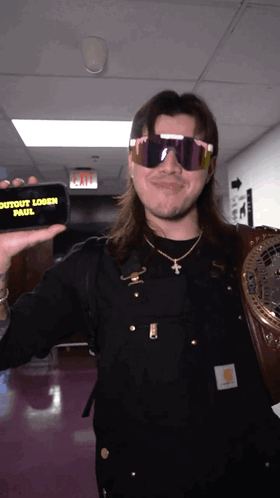 Man In Sunglasses Holding Phone Saying Outout Logan Paul GIF