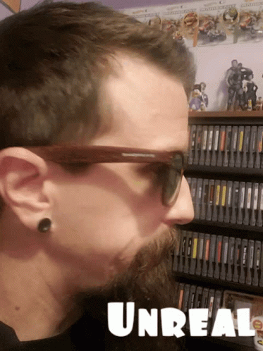 Man In Sunglasses In Front Of Bookshelf Unreal GIF