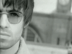 Man in Sunglasses in Front of Clock Tower Black and White