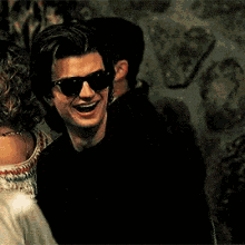Man in Sunglasses Laughing Holding Red Cup