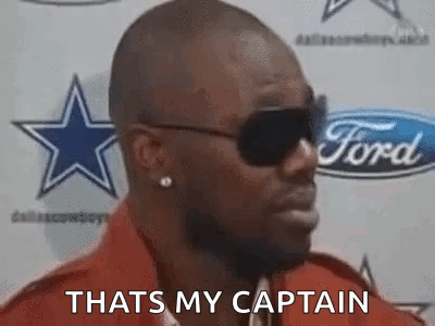 Man In Sunglasses, Red Shirt At Ford Sign GIF