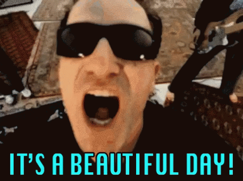Man In Sunglasses Saying It's A Beautiful Day GIF