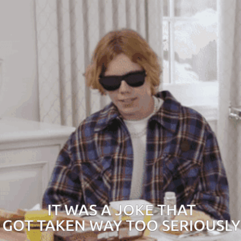 Man in Sunglasses Saying Joke Was Taken Seriously