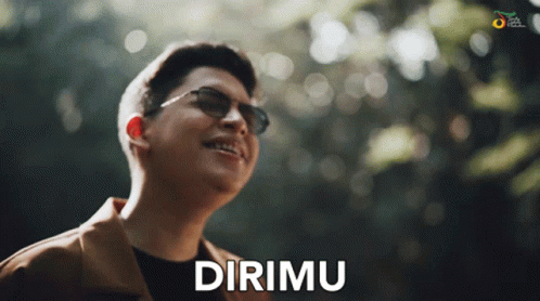 Man in Sunglasses Says Dirimu in Front of Trees