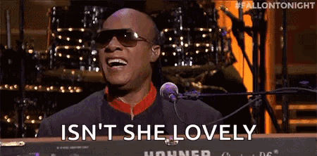 Man in Sunglasses Singing and Playing Keyboard