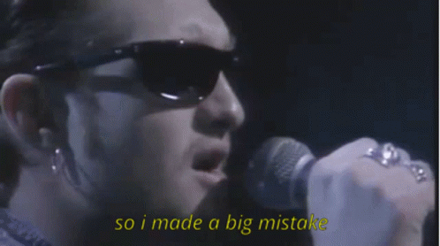 Man in Sunglasses Singing Into Microphone Saying So I Made a Big Mistake