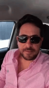 Man In Sunglasses Sitting In Back Seat Of Car GIF