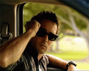 Man in Sunglasses Sitting in Car