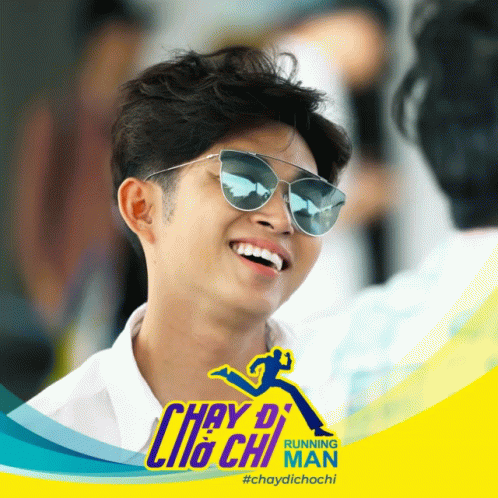 Man in Sunglasses Smiling in Front of Running Man Ad