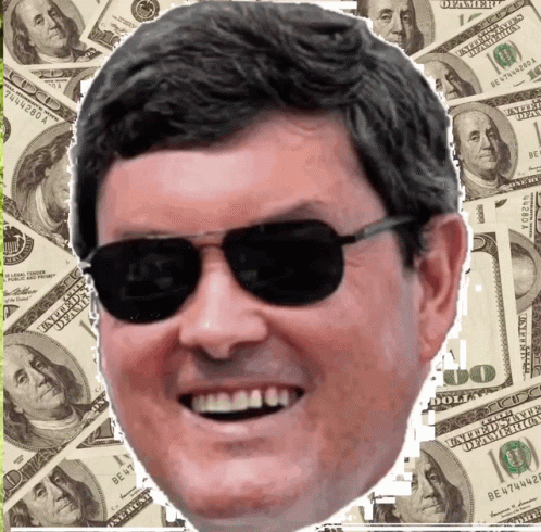 Man in Sunglasses Smiling With Hundred Dollar Bills