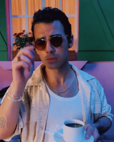 Man In Sunglasses Smoking Cigarette Holding Coffee GIF