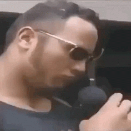 Man In Sunglasses Smoking Cigarette GIF