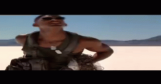Man in Sunglasses Standing in Desert Hands on Hips