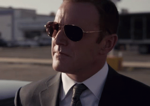 Man in Sunglasses, Suit, and Tie
