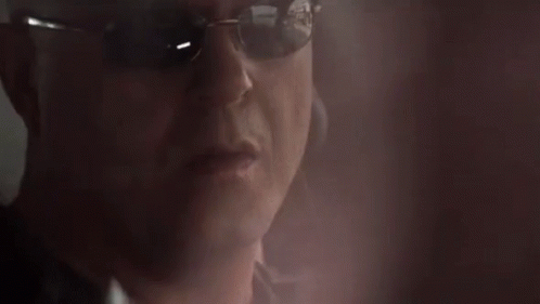 Man in Sunglasses Talking on Cellphone